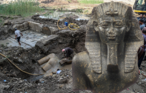 Workers prepare to remove the statue from the mud, inset, a bust of Psamtek I on display at the Met. Museum of Art.