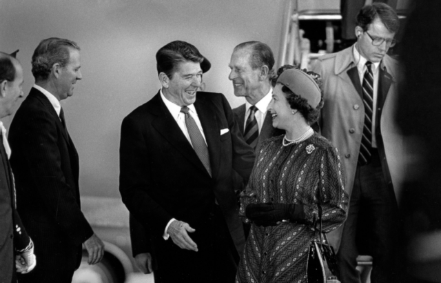 During the Royal tour to the West Coast of the United States, President Ronald Reagan and The Queen share a laugh with Prince Philip in the background.