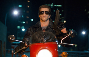 Arnold Schwarzenegger riding a motorcycle as the Terminator