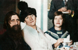 Grigori Rasputin, Praskovya Fedorovna Dubrovina, and Maria Rasputin sitting together for tea.