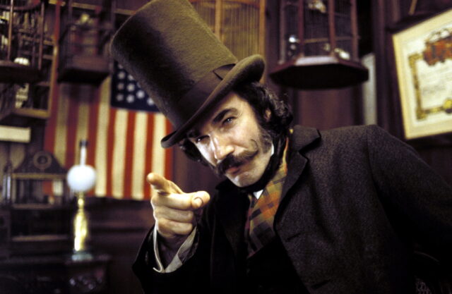 Daniel Day-Lewis as William Cutting in a top hat, pointing his finger.