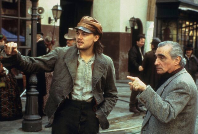 Leonardo DiCaprio and Martin Scorsese standing on set.
