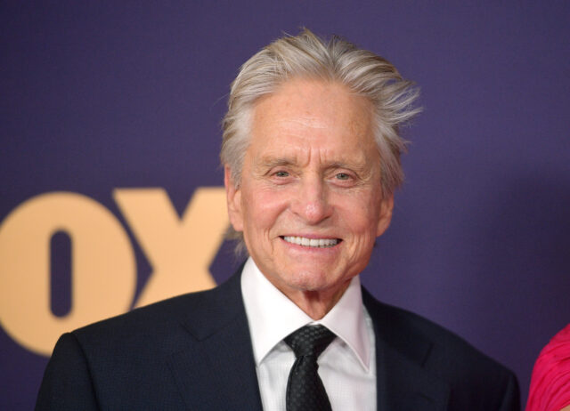 Michael Douglas standing on a red carpet