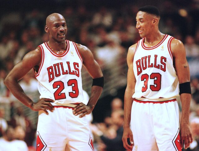 Michael Jordan and Scottie Pippen in Chicago Bulls Jerseys on the court.