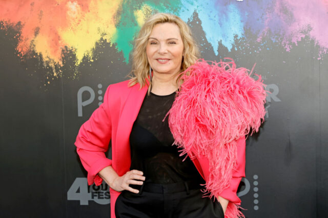 Cattrall wearing a pink jacket at the "Queer As Folk" World Premiere 