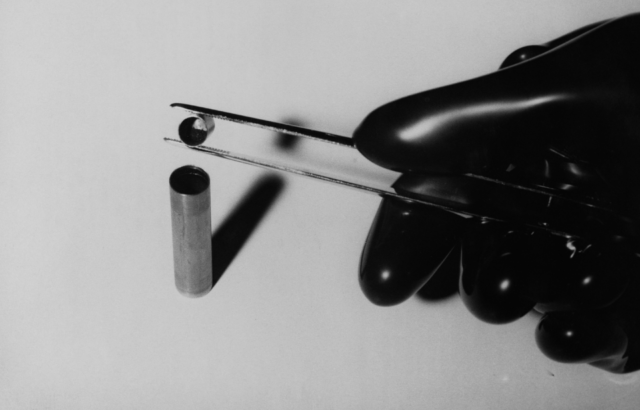 Radioactive substance being poured into a tantalum capsule. 