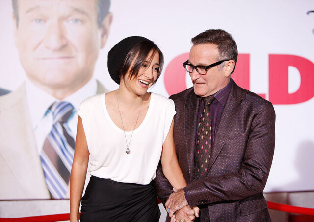 Zelda and Robin Williams standing on a red carpet