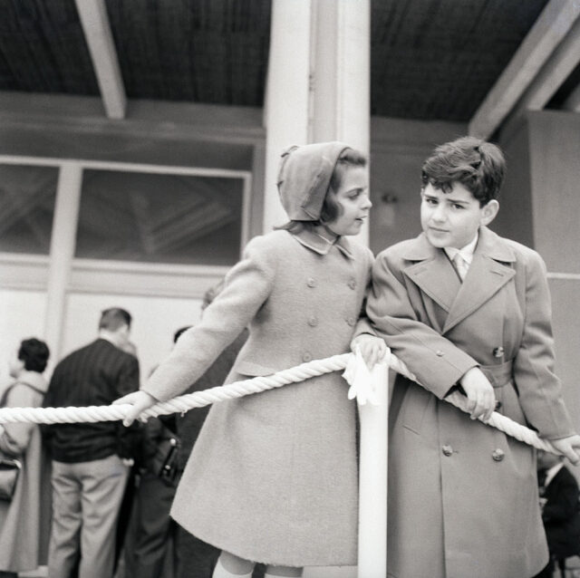 Christina and Alexander Onassis standing together on a yacht