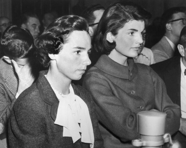 Jackie Kennedy and Ethel Kennedy sitting side-by-side.