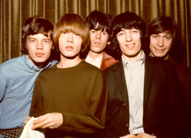 A photo of the original five members of the Rolling Stones, Mick Jagger, Brian Jones, Keith Richards, Bill Wyman, and Charlie Watts.