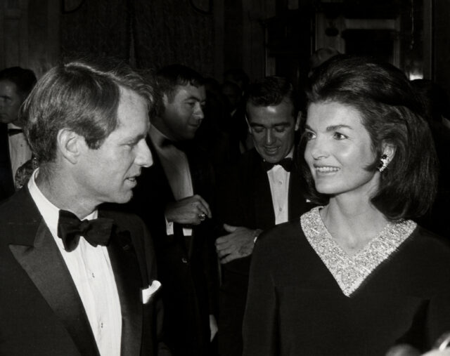 Robert F. Kennedy looking at Jackie Kennedy. 