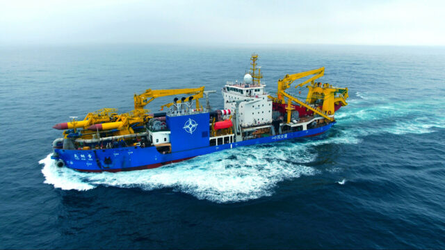An aerial view of a Chinese dredger at sea.