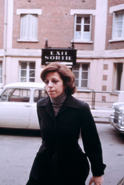 Christina Onassis walking down a street