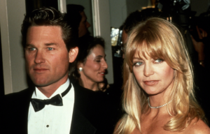 Kurt Russell and Goldie Hawn dressed in black tie.
