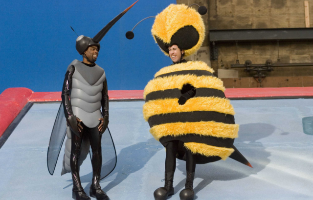 Behind the scenes photo of Jerry Seinfeld and Chris Rock in costume as their characters from the Bee Movie. 