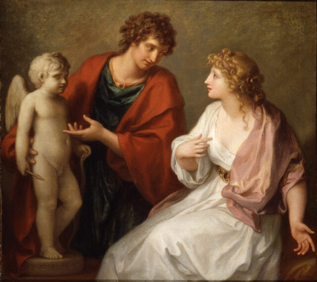 Praxiteles with curly brown hair and a red robe, points towards a small statue of cupid while looking at Phryne, wearing a white robe and pink shawl. 