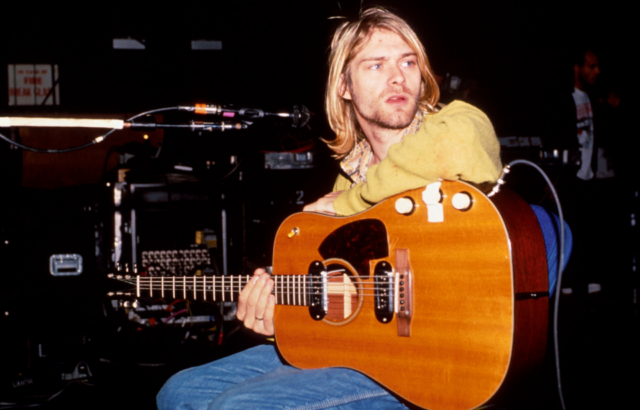 Kurt Cobain sitting with a guitar