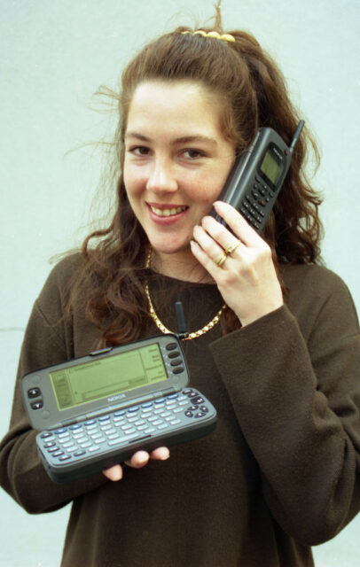 Young woman talking on a Nokia phone.