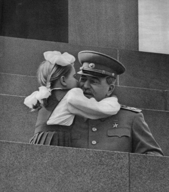 Little girl hugging Joseph Stalin