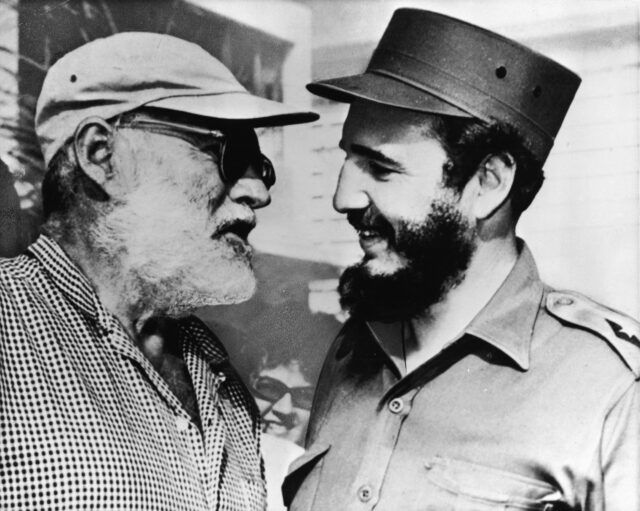 Ernest Hemingway speaking with Fidel Castro