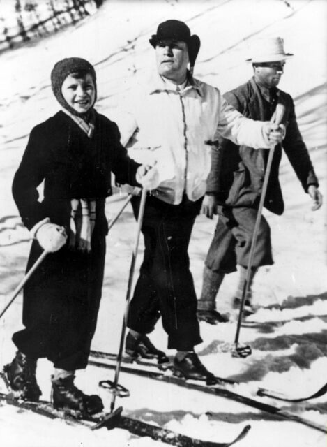 Benito and Romano Mussolini cross-country skiing with an unknown man