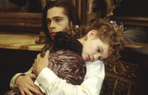 Kirsten Dunst hugging Brad Pitt in 'Interview with the Vampire'