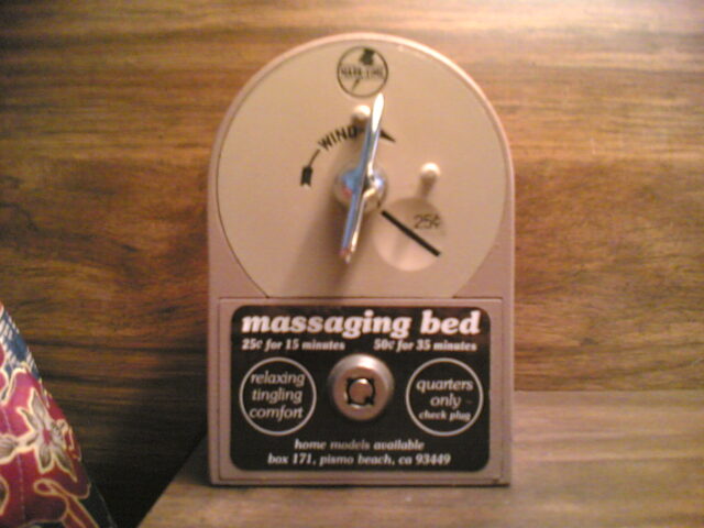 Close up view of the coin slot for a massaging bed.
