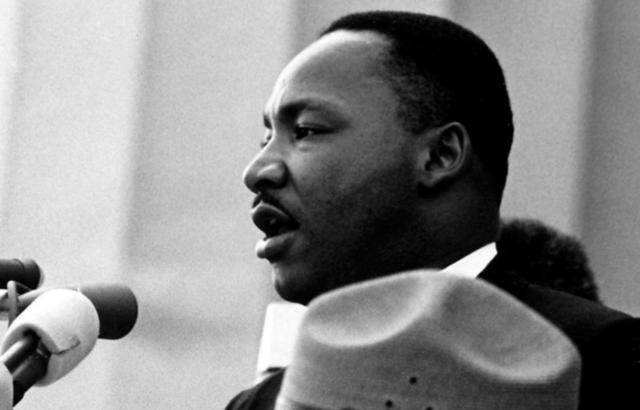 Martin Luther King Jr. speaking at a podium