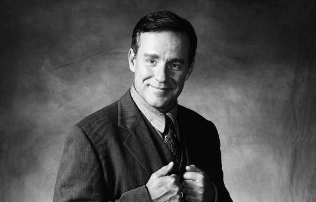 Phil Hartman as Bill McNeal in a promo shot for season 3 of NewsRadio. 
