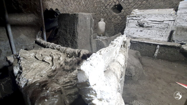 Bed and other relics found in a slave room in Pompeii