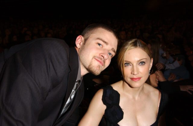Justin Timberlake posing for a photo with Madonna