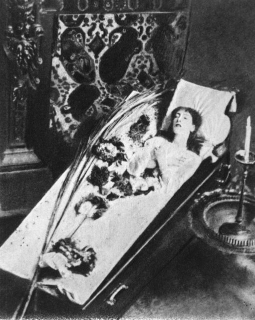 Woman resting in a coffin
