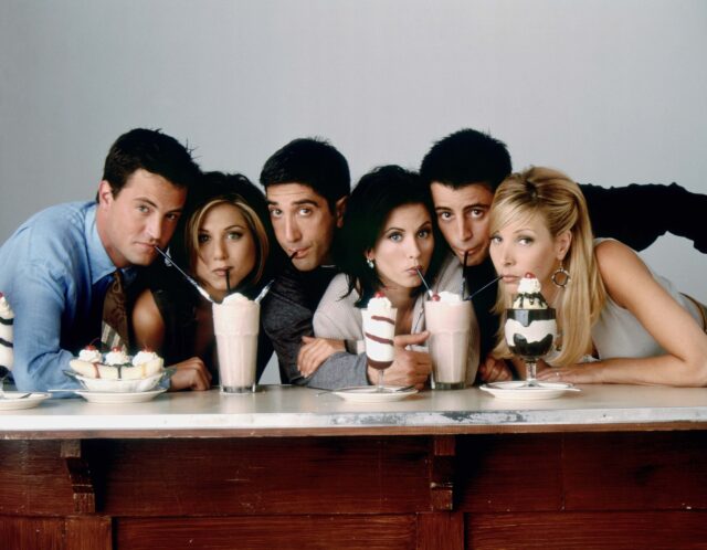 Publicity still for 'Friends,' showing the cast drinking milkshakes