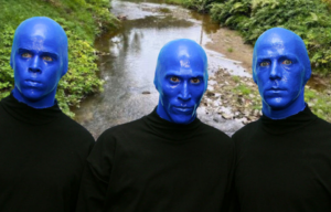 Troublesome Creek running along a road + Portrait of the Blue Man Group