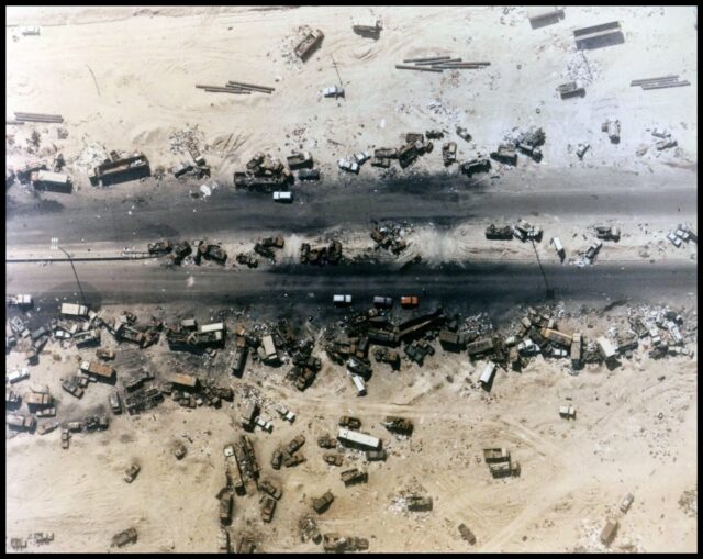 Aerial view of burned-out vehicles along the Highway of Death