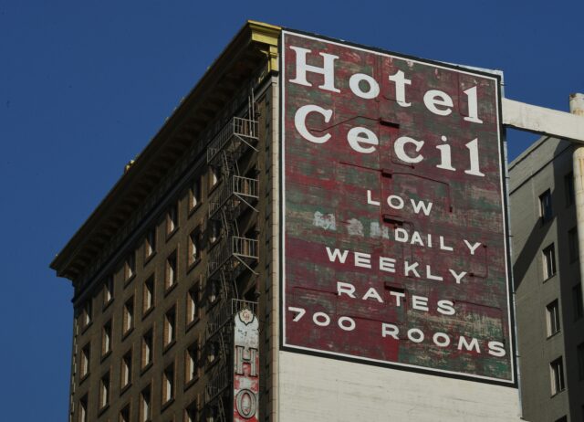Exterior sign for the Cecil Hotel, located on the side of the building