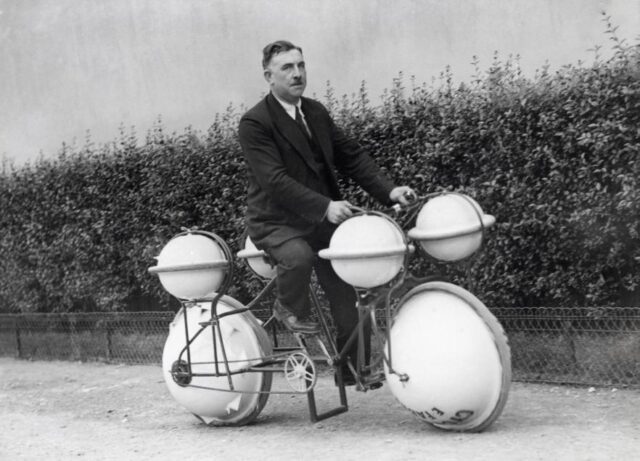 A man riding a strange-looking bicycle.