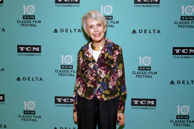 Barbara Rush standing on a red carpet