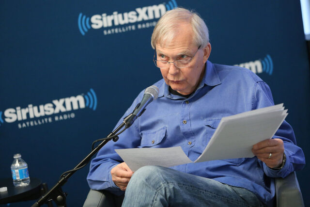 Bob Edwards sitting in front of a microphone