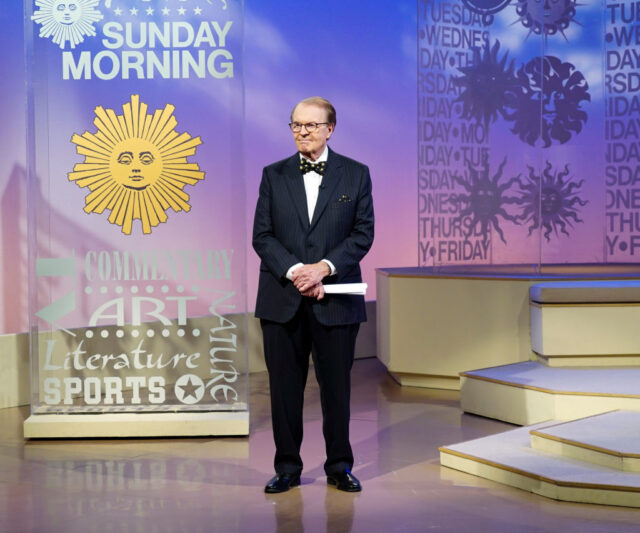 Charles Osgood standing on stage