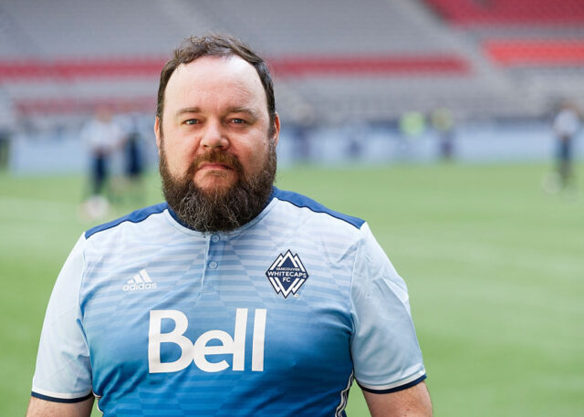 Chris Gauthier standing on a football pitch