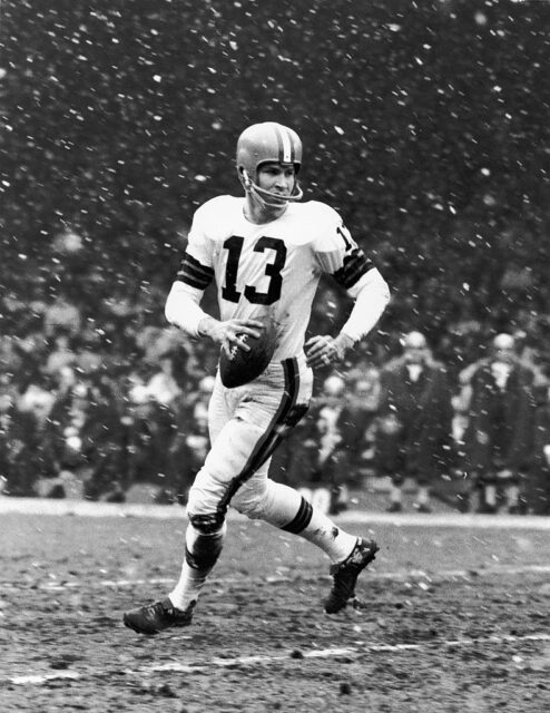 Frank Ryan running with a football