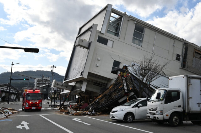 Damaged buildings on a street after an earthquake.