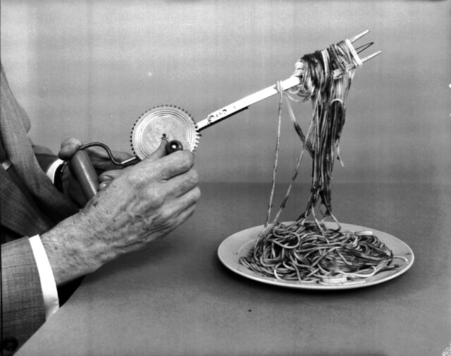 A hand-crank spinning fork with spaghetti on it.