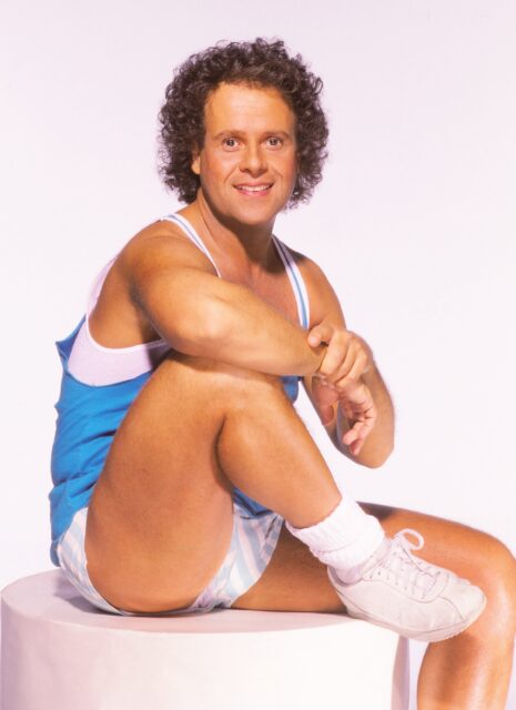Richard Simmons sitting for a picture.