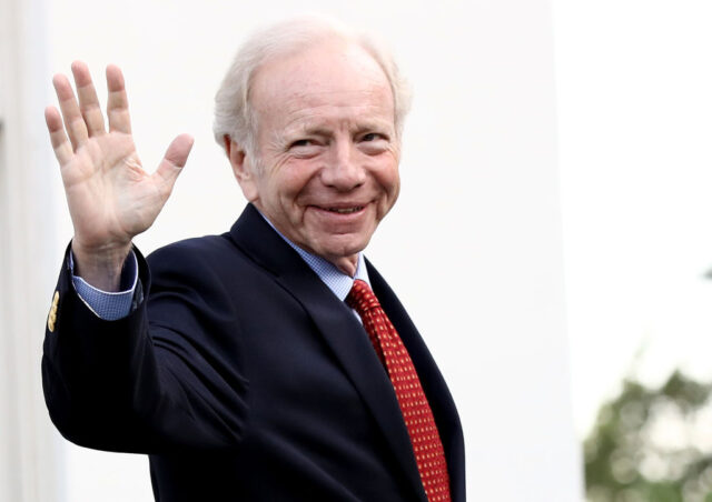 Joe Lieberman waving while walking