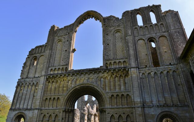 A view looking up at the west wall entrance of Castle Acre Priory.