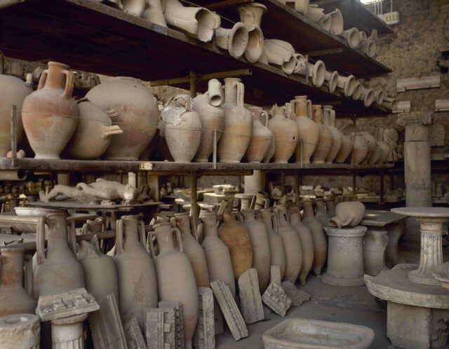 Roman pottery lining shelves.