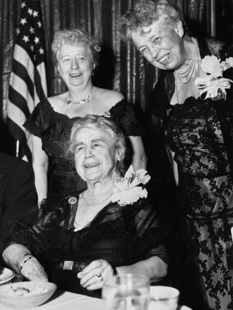 Bess Truman, Edith Wilson, and Eleanor Roosevelt posing together for a photo.