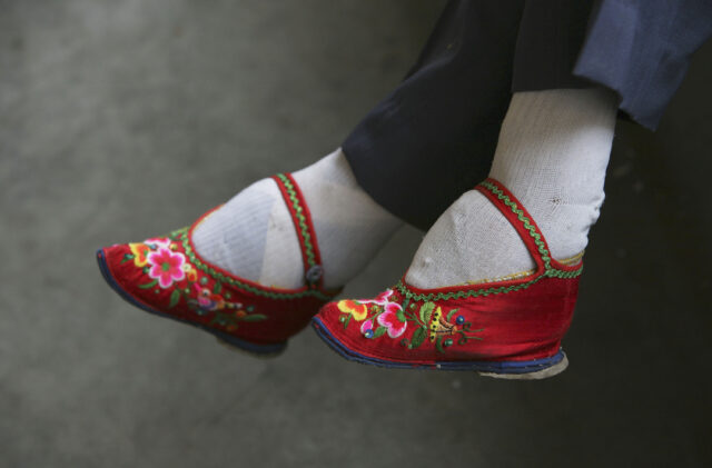 Lotus shoes on a woman's feet.